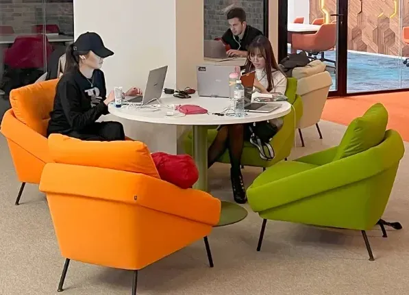 Meeting spaces come in more than one size Meeting and collaboration space with a table and soft seating