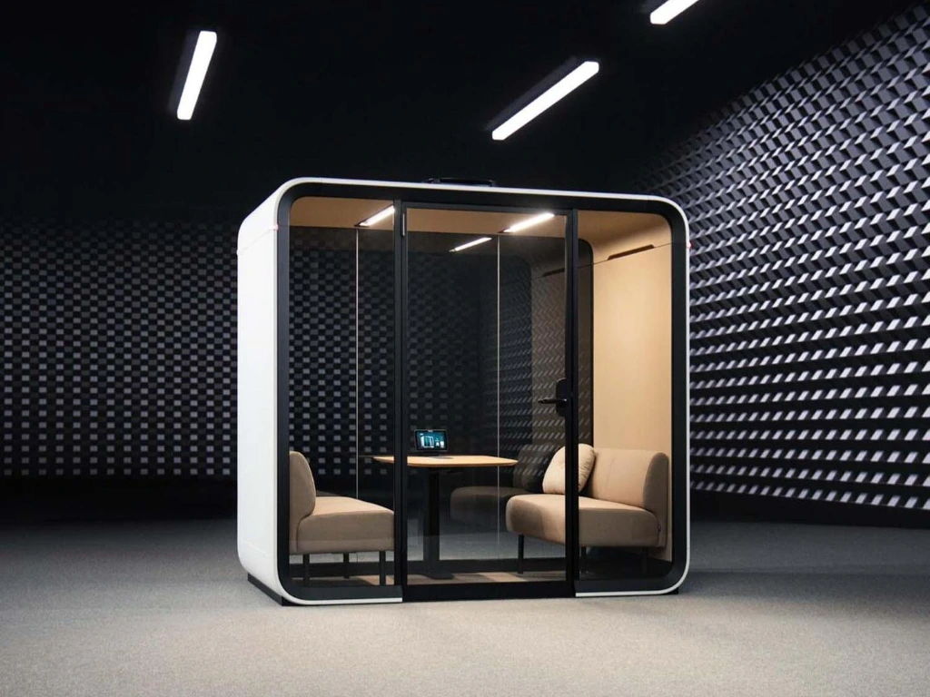 Acoustic booth in an open-plan office Acoustic phone booth placed inside an open-plan office