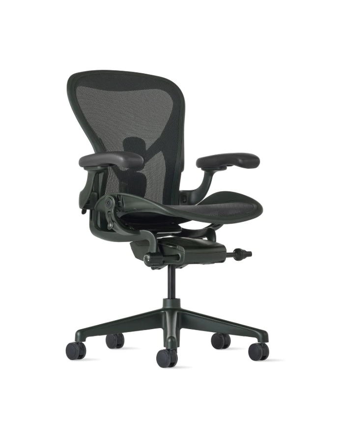 Herman Miller Aeron Chair Tilted side view of a Herman Miller Aeron Chair in graphite with PostureFit, covered by the 12-year warranty