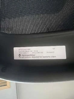 Second example of the manufacturing label Second example of the manufacturing label under a Herman Miller chair seat with the notice not to remove it